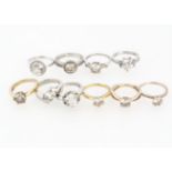 A collection of ten silver and CZ solitaire dress rings, various settings ring size L