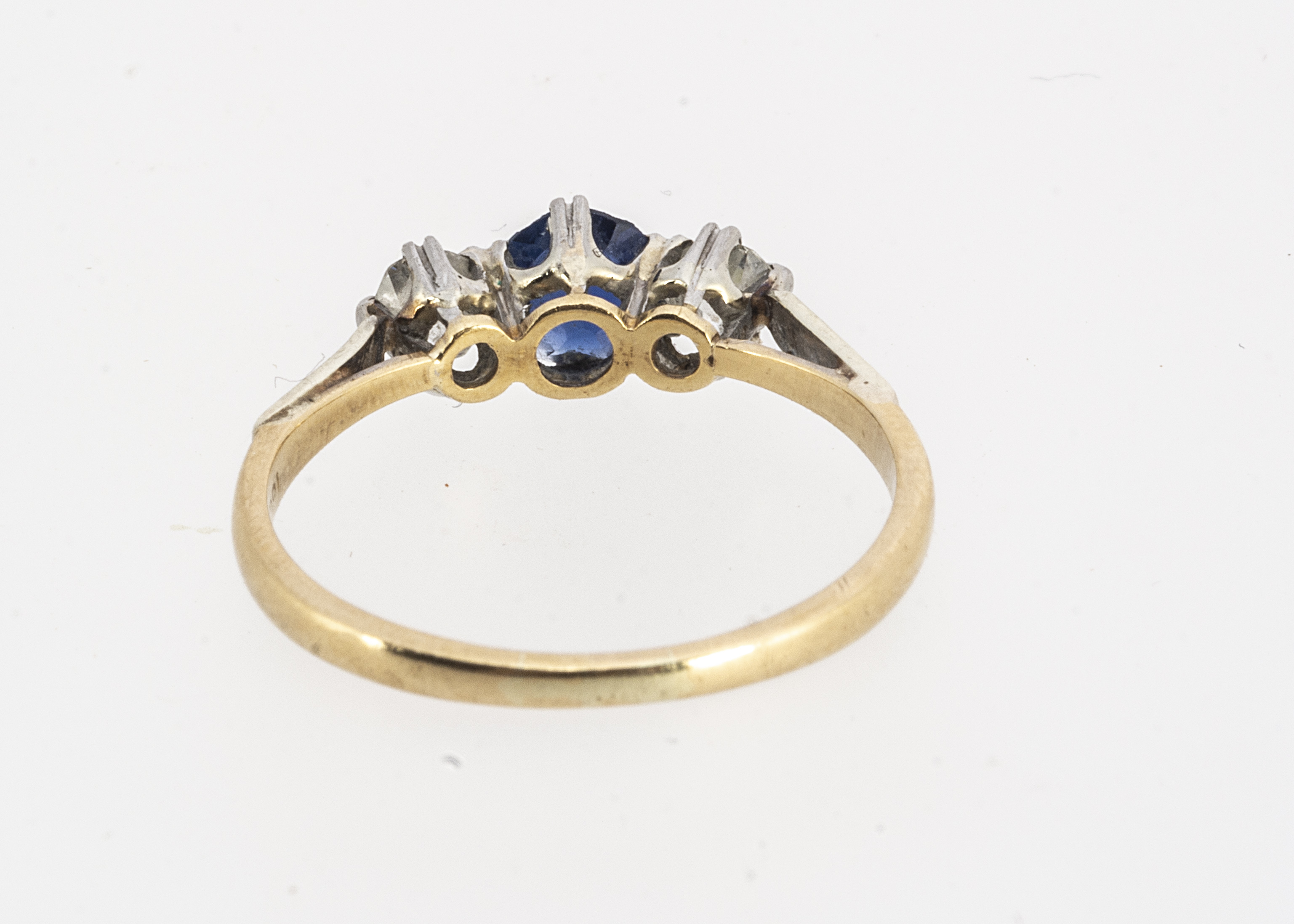 An 18ct gold and platinum three stone diamond and sapphire ring, the central circular claw set - Image 2 of 2