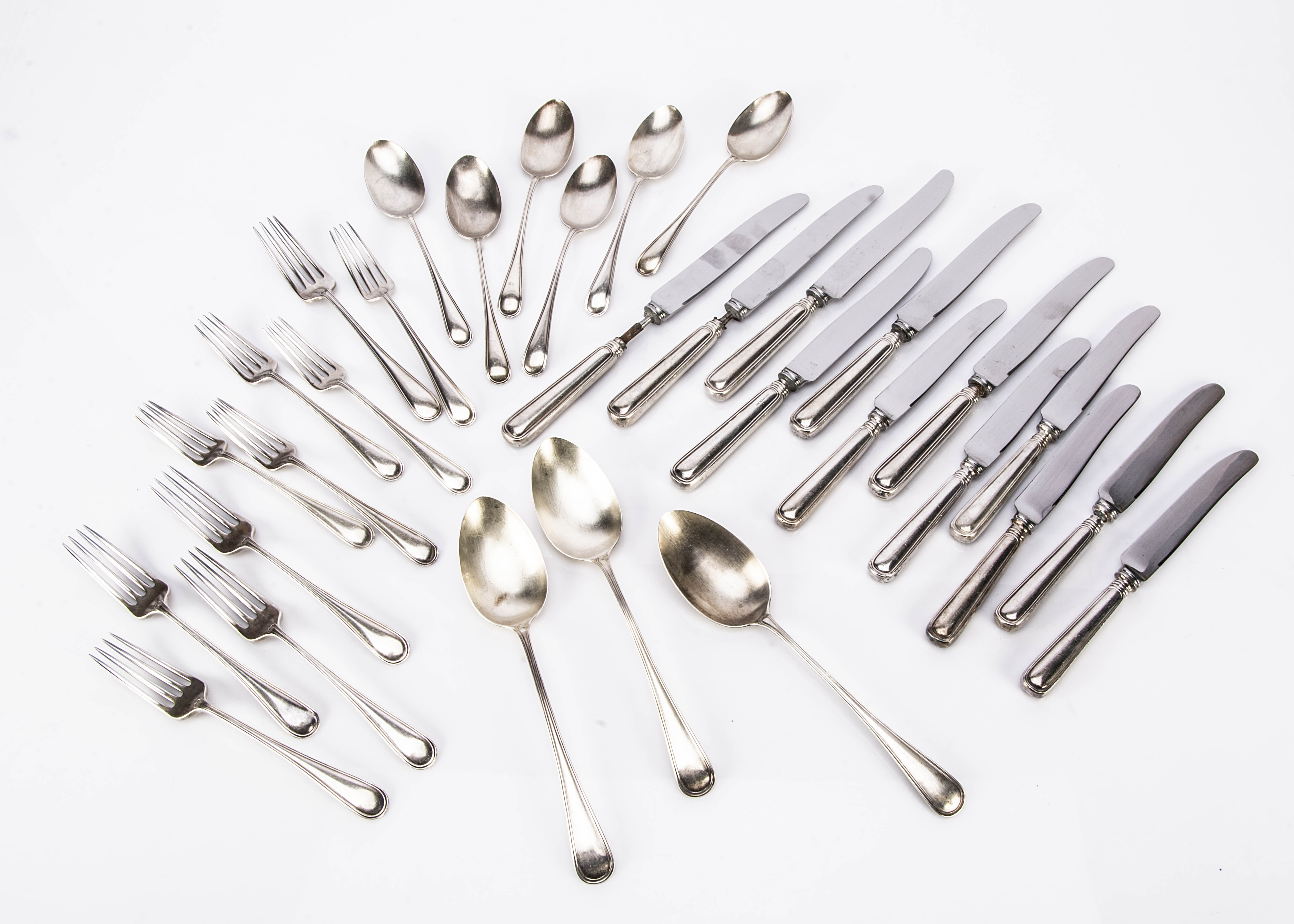 A part canteen of Art Deco period cutlery from Birks, marked Sterling, with three tablespoons, six