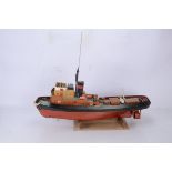 Kitbuilt Radio Control Pond Tug, plastic construction, hull in red and black, brown, tan and white