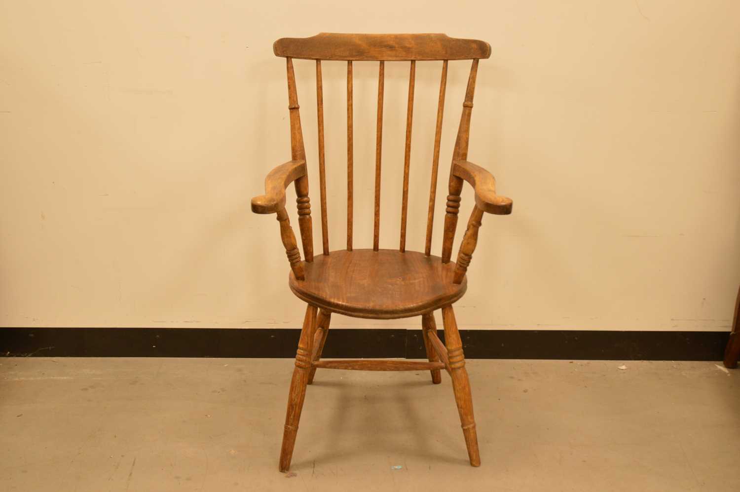 A 19th century elm stick back armchair,