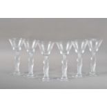 A set of six drinking glasses with frosted female figure stems,