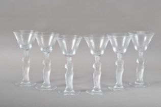 A set of six drinking glasses with frosted female figure stems,