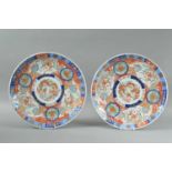 A pair of late Meiji period Japanese porcelain Imari large dishes,