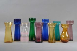A collection of coloured glass vases,