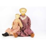 A large and small Greiner type papier-mache shoulder-head dolls,