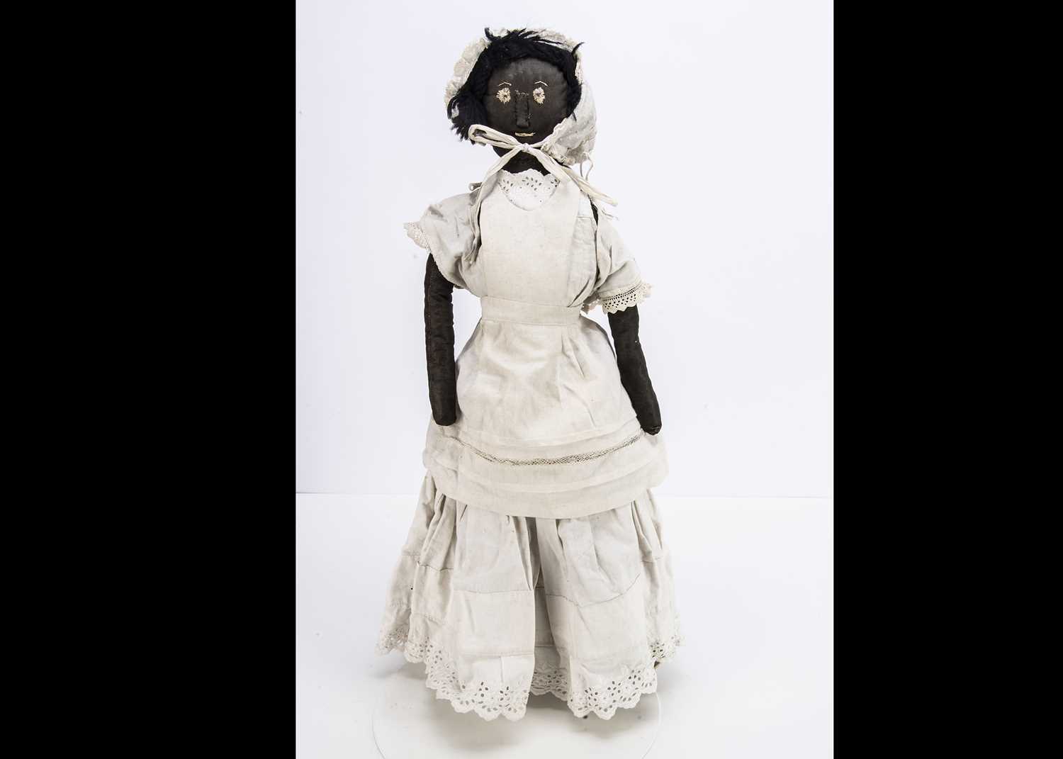 A primitive black cloth doll circa 1900,