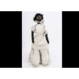 A primitive black cloth doll circa 1900,