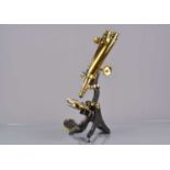 A late 19th Century lacquered brass and black-painted Wenham Compound Binocular Microscope,