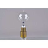 A 19th Century early lacquered brass and glass vacuum Electric Lamp Bulb,