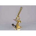 A late 19th Century lacquered brass J H Steward Compound Monocular Microscope,