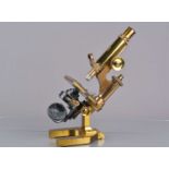 A late 19th Century lacquered brass Leitz Compound Monocular Microscope,