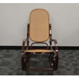 A late 20th century bent wood rocking chair,