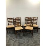 A set of six early 20th century ladder back chairs,