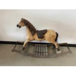 A c1970s carved wooden rocking horse,