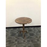Early 18th century pine tripod table,