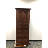 A 20th century narrow cabinet,