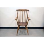 A 19th century elm stick back armchair,