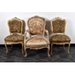 A pair of early 20th century French painted and upholstered chairs,