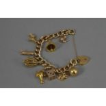 A 9ct. Gold hollow curbed linked charm bracelet,