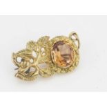 A 19th Century yellow metal (untested) imperial topaz flower and hand brooch,