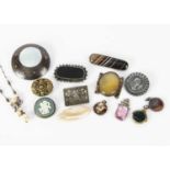 A collection of hardstone and silver set brooches and pendants,