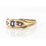 A 15ct gold sapphire and diamonds three stone gypsy set dress ring,