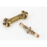 A 19th Century garnet and rock crystal bar brooch,