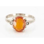 An 18ct gold fire opal and diamond three stone dress ring,