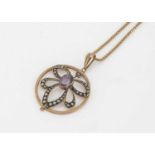 An Edwardian 9ct gold amethyst and seed pearl drop openwork pendant,