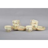 A set of six Crown Devon tea plates and cups,