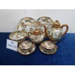 A c1950s Japanese porcelain Satsuma palette tea set for eleven