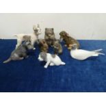 A group of Royal Copenhagen porcelain small dogs and animals,