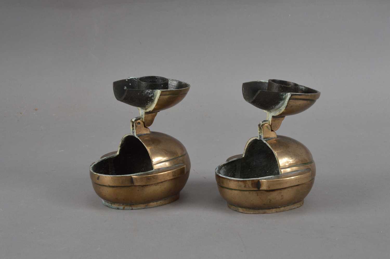 Two Chinese brass travel candlesticks,