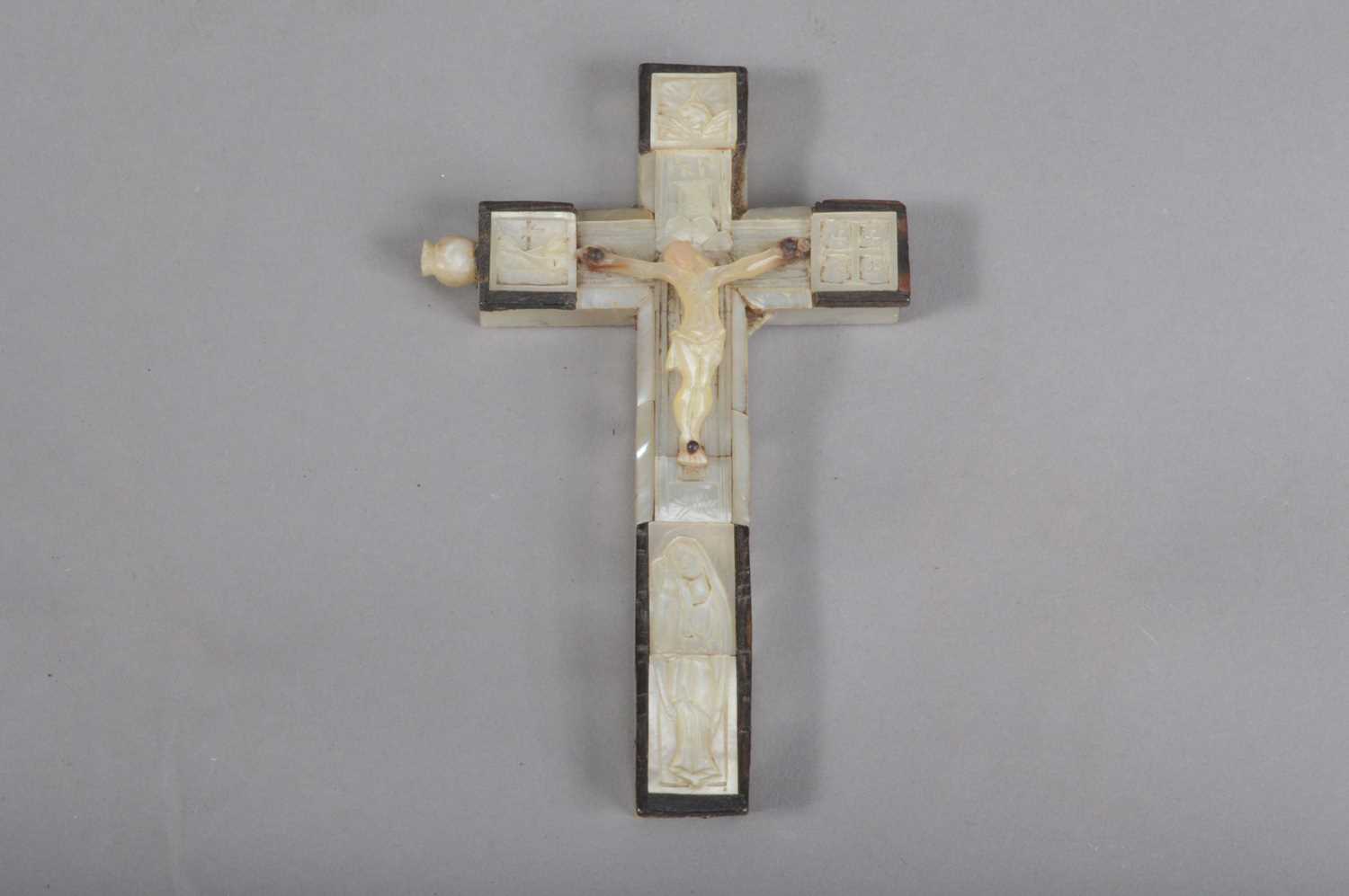 A late 19th century Jerusalem olive wood and mother of pearl crucifix,