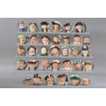 A large collection of miniature Royal Doulton character jugs,