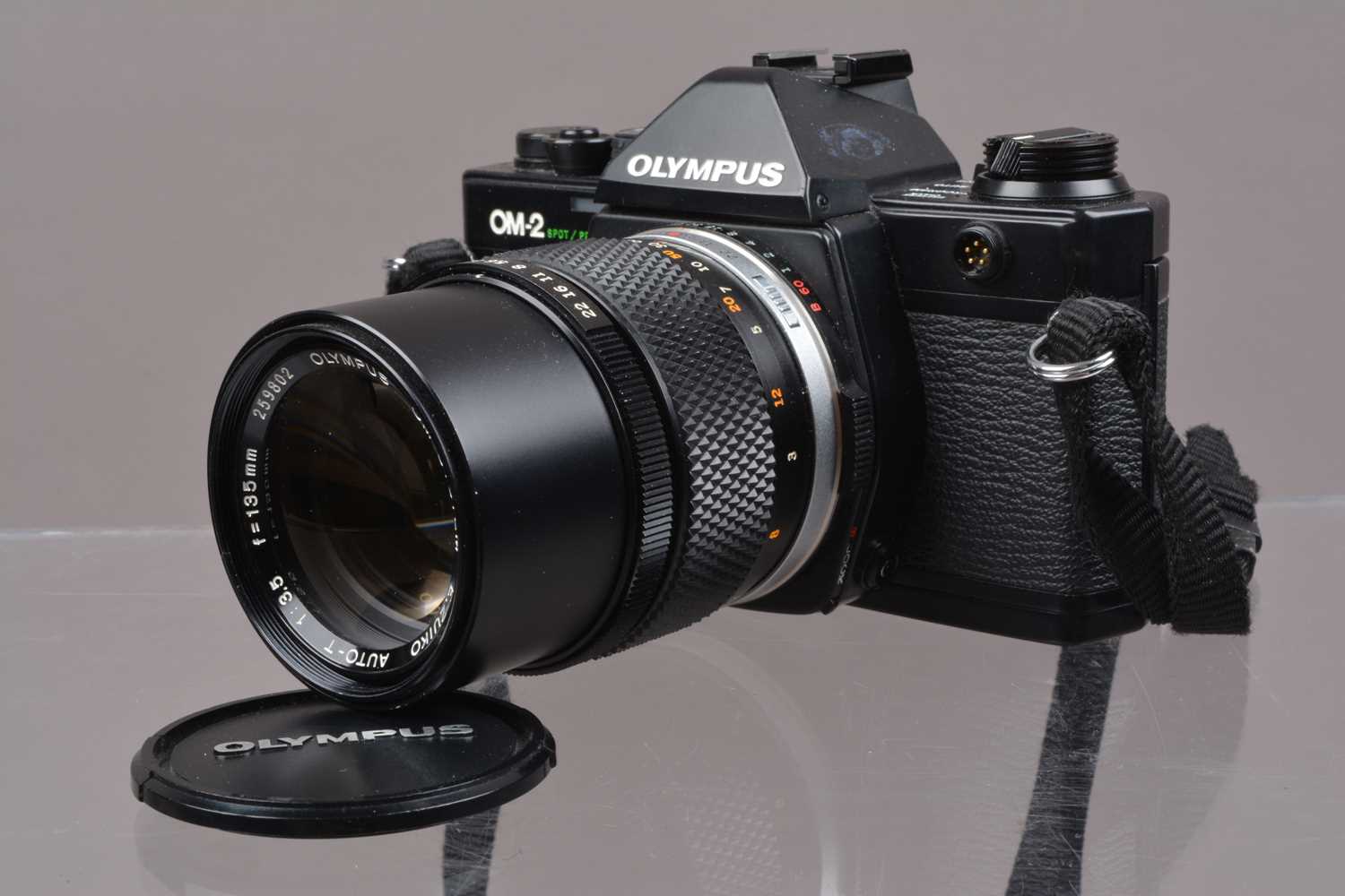 An Olympus OM-2 Spot/Program SLR Camera,