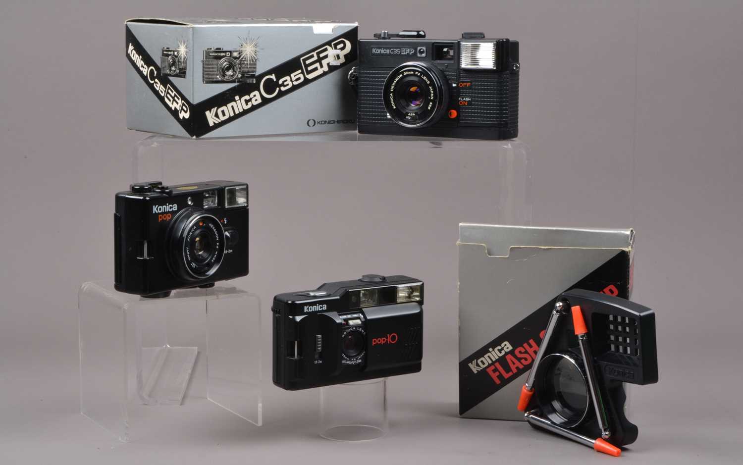 Three Konica Compact Cameras,