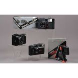 Three Konica Compact Cameras,
