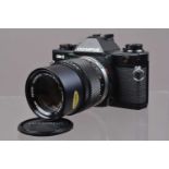 An Olympus OM-2 Spot/Program SLR Camera,