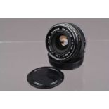 An Olympus G Zuiko 28mm f/3.5 OM Lens,