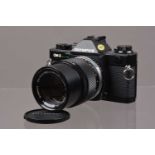 An Olympus OM-2 Spot/Program SLR Camera,