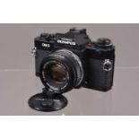 An Olympus OM-3 SLR Camera,