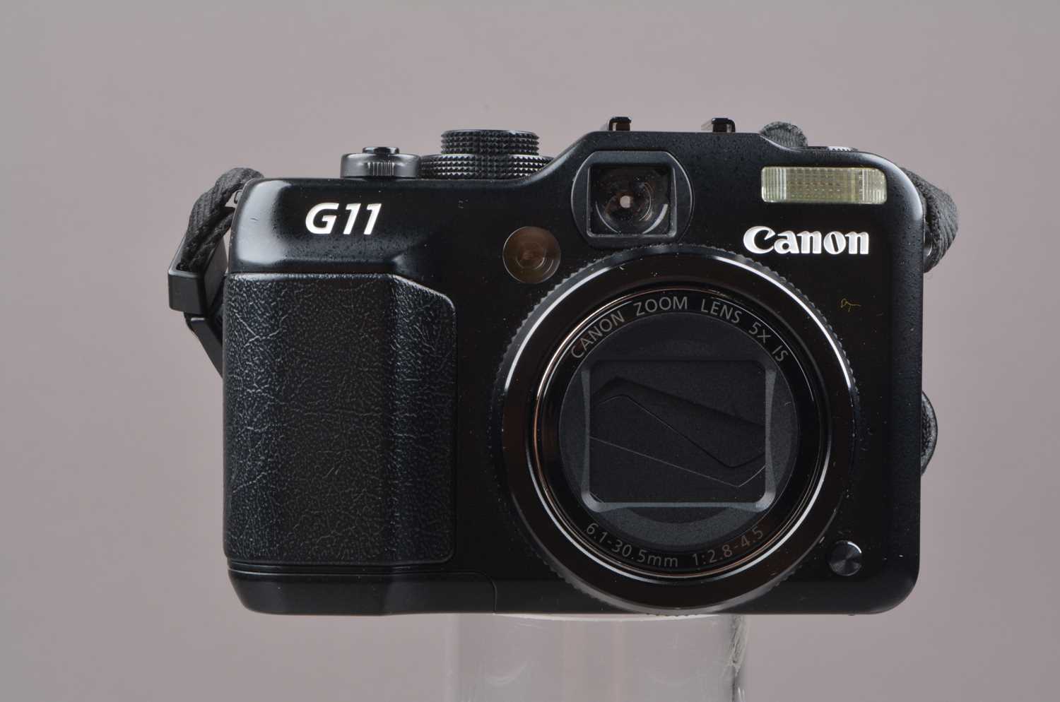 A Canon G11 Digital Camera,