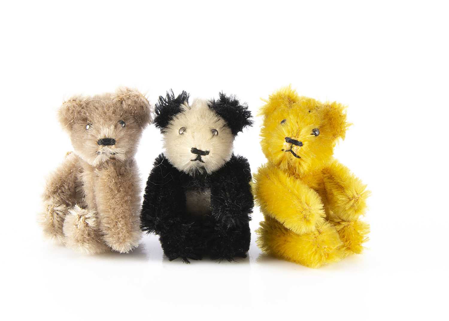 Three post-war Schuco miniature Teddy Bears,