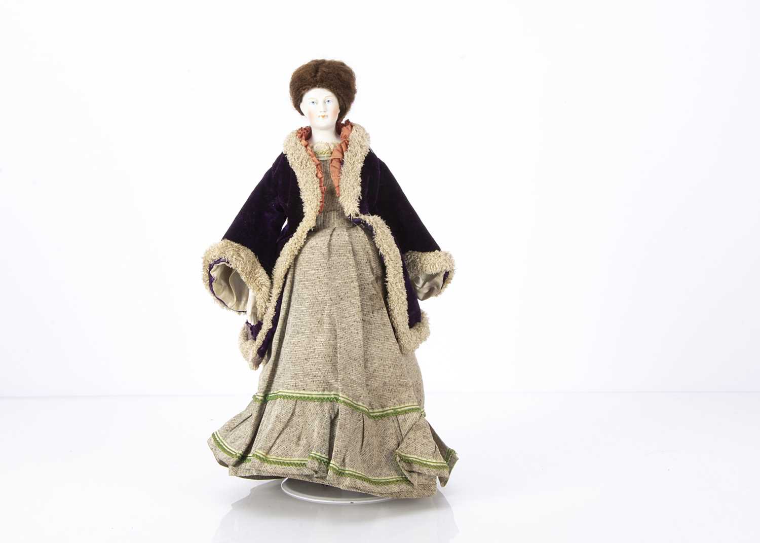 A mid 19th century German bisque shoulder head wigged doll,