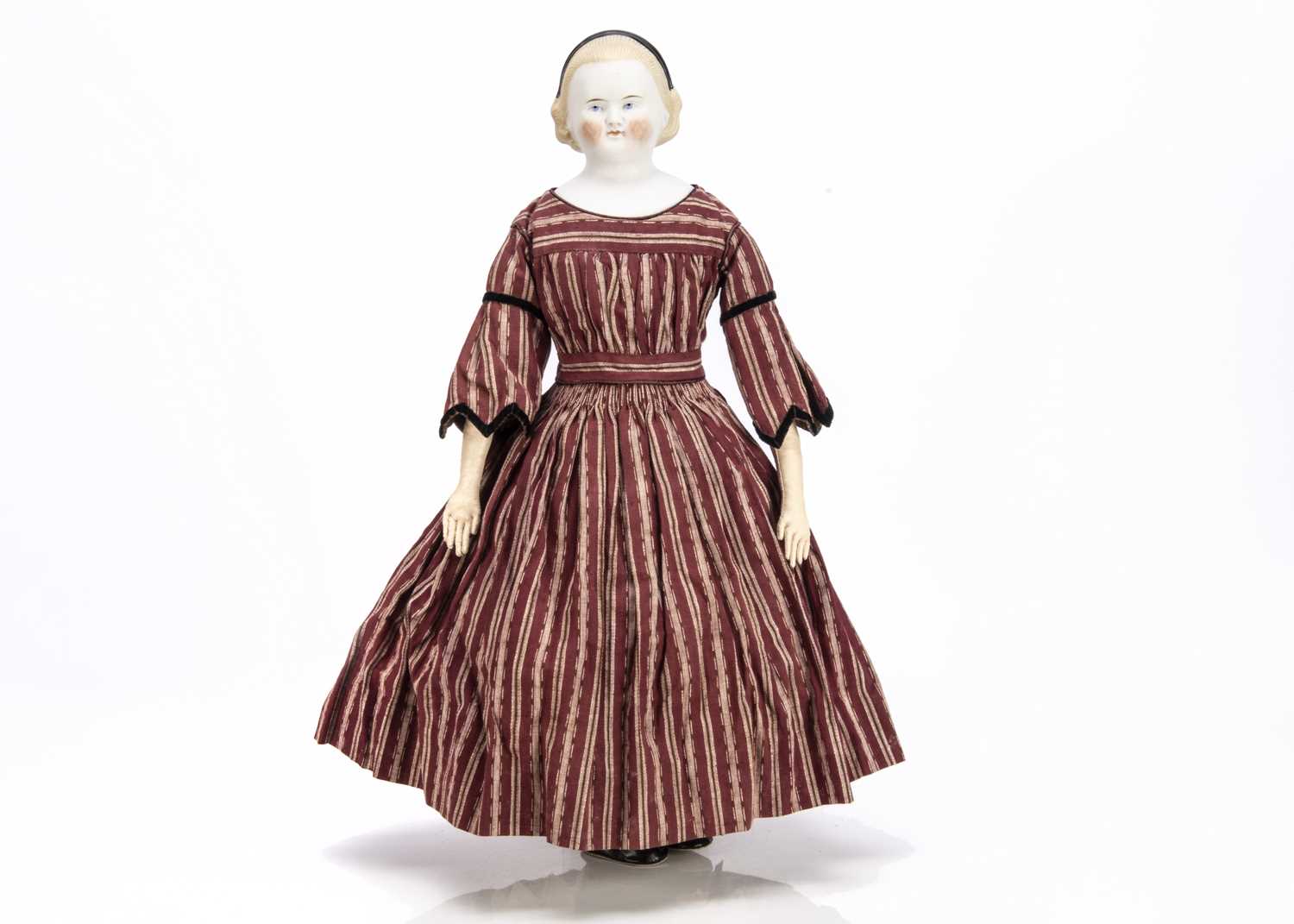 A mid 19th century bisque shoulder-head child doll,