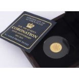An Elizabeth II Jersey 9ct gold proof one penny coin,