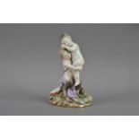 A 19th century Meissen seconds quality porcelain figurine of a cherub and satyr,