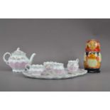 A 20th century continental porcelain tea set for two,